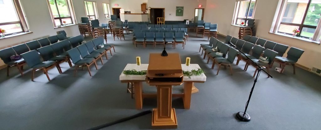 empty worship room with chairs set up in a round table
