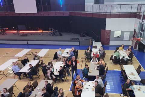 Community meal in gym